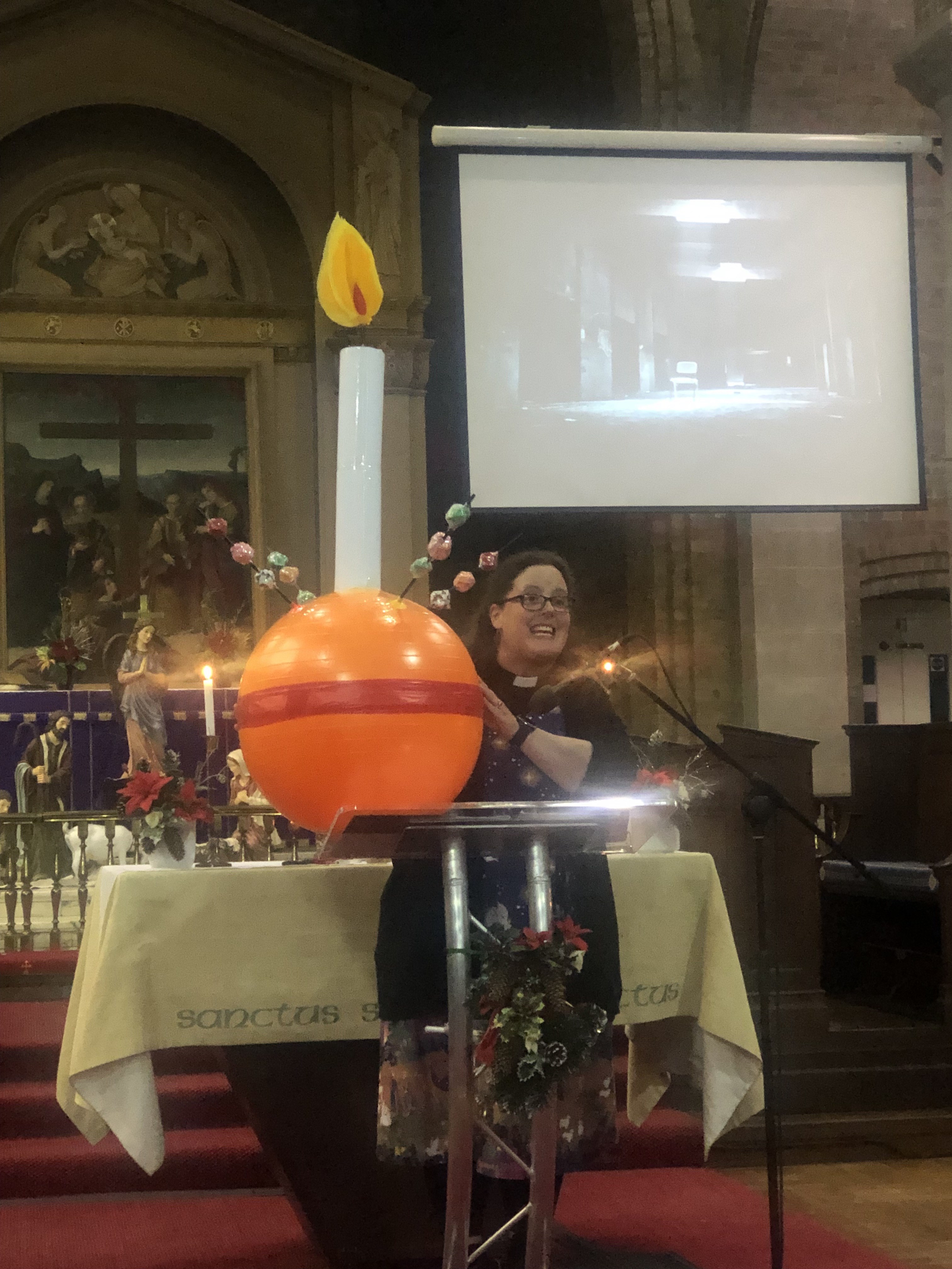 Emma showing large Christingle