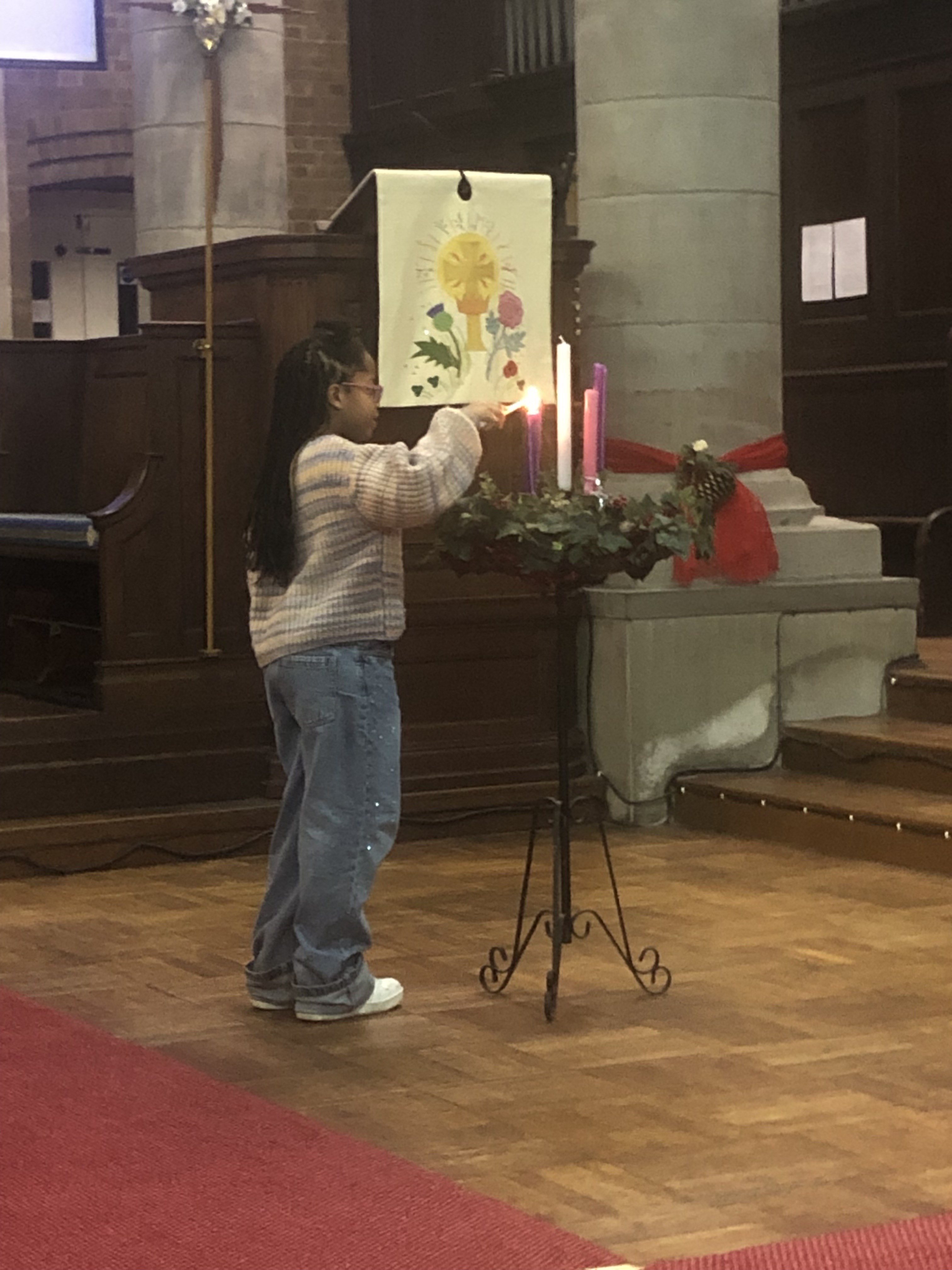 Ceanna lighting the Advent Can